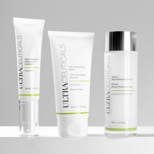 Three Ultraceuticals skincare essentials shine against a neutral background: a 30 ml antioxidant serum, a 75 ml energizing mask, and a 30 ml skin-perfecting serum. | Indira Salon Spa